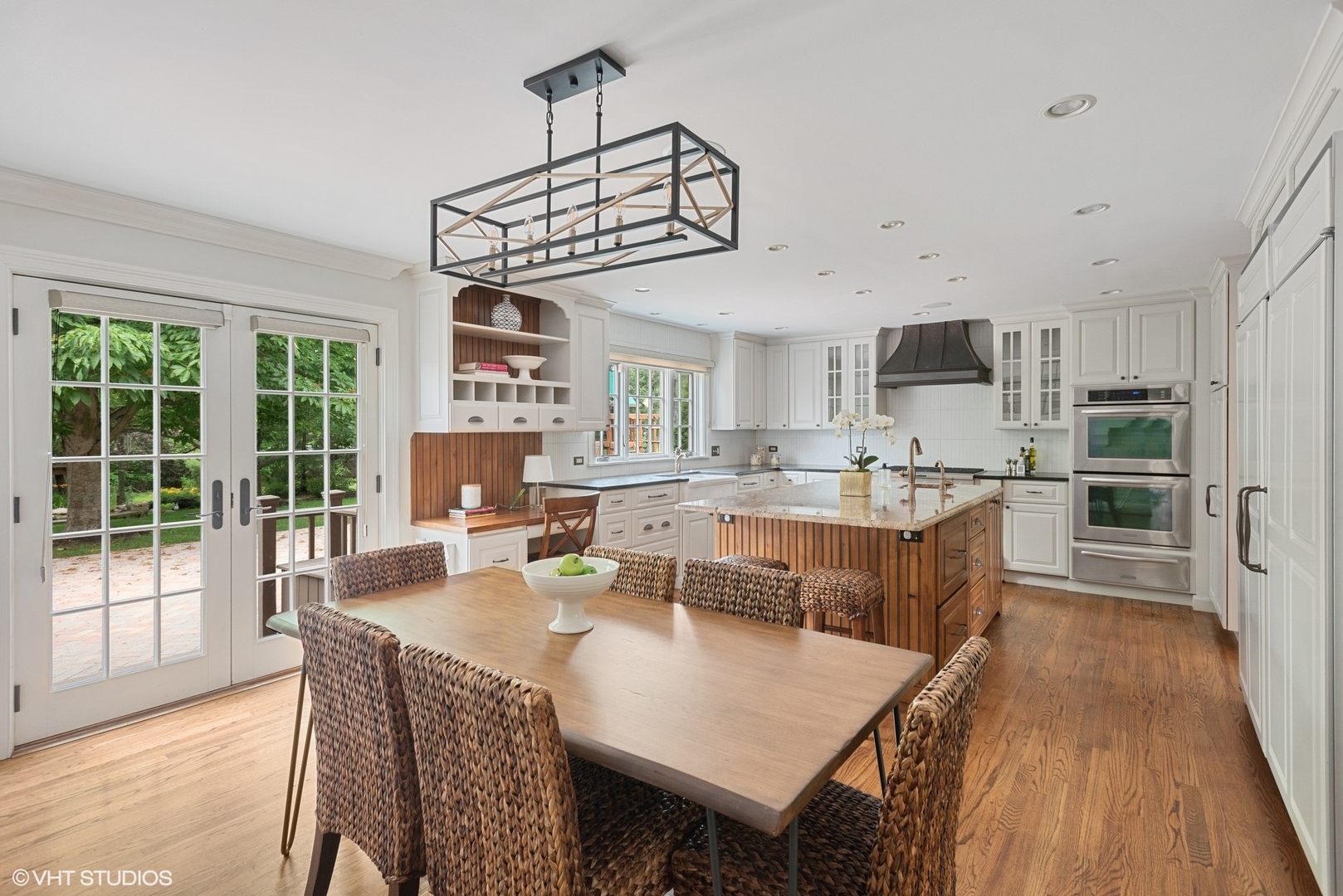 2420 Dorina Drive Northfield, IL 60093 - Photo 17 of 51 a view of a dining room with furniture window and wooden floor