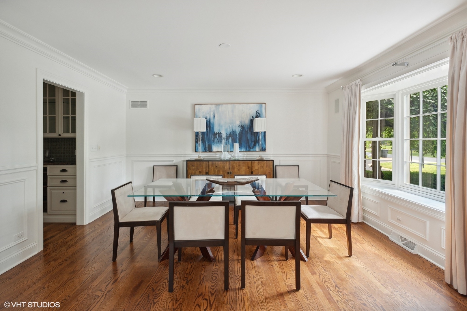 2420 Dorina Drive Northfield, IL 60093 - Photo 21 of 51 a view of a dining room with furniture window and wooden floor