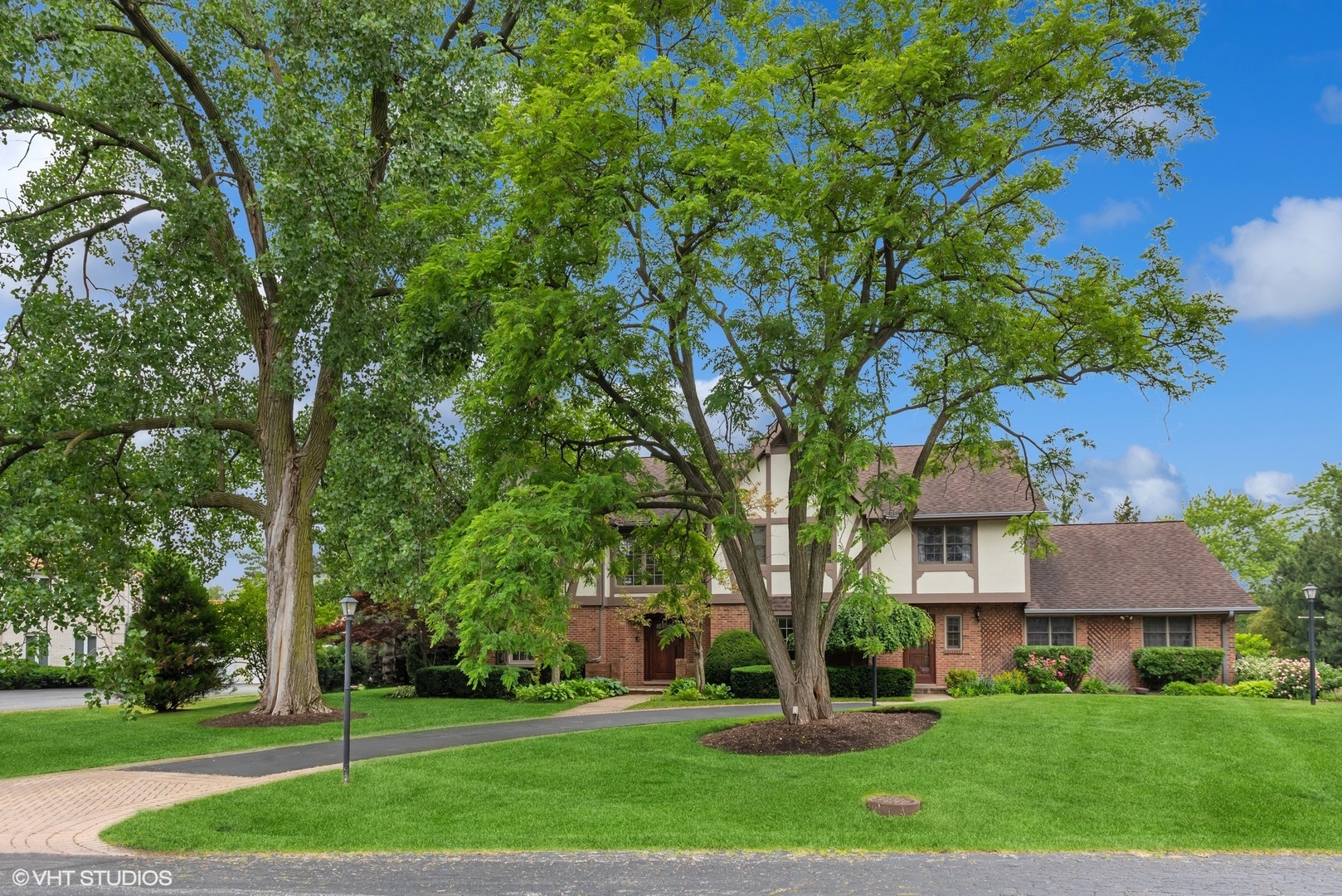 2420 Dorina Drive Northfield, IL 60093 - Photo 3 of 51 a front view of a house with a yard