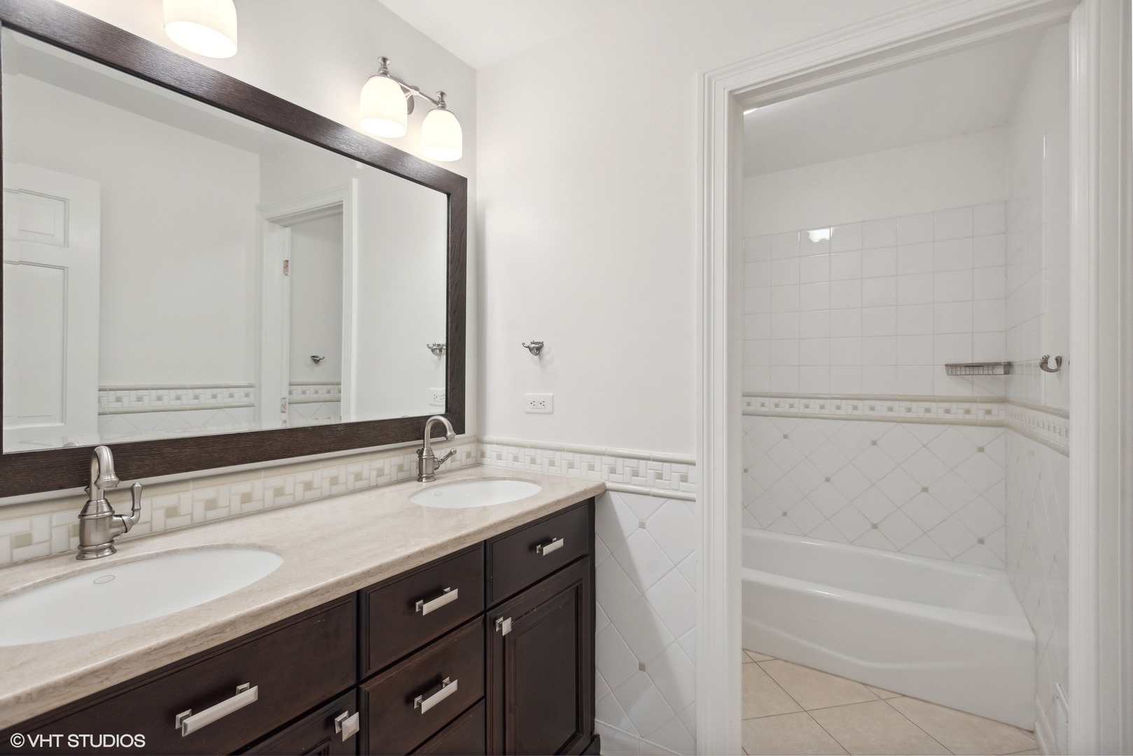 2420 Dorina Drive Northfield, IL 60093 - Photo 33 of 51 a bathroom with a bathtub and a sink