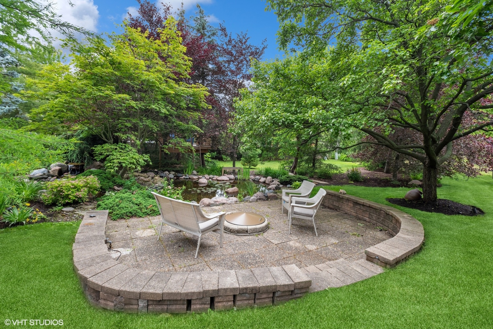 2420 Dorina Drive Northfield, IL 60093 - Photo 42 of 51 a view of a backyard with garden and patio
