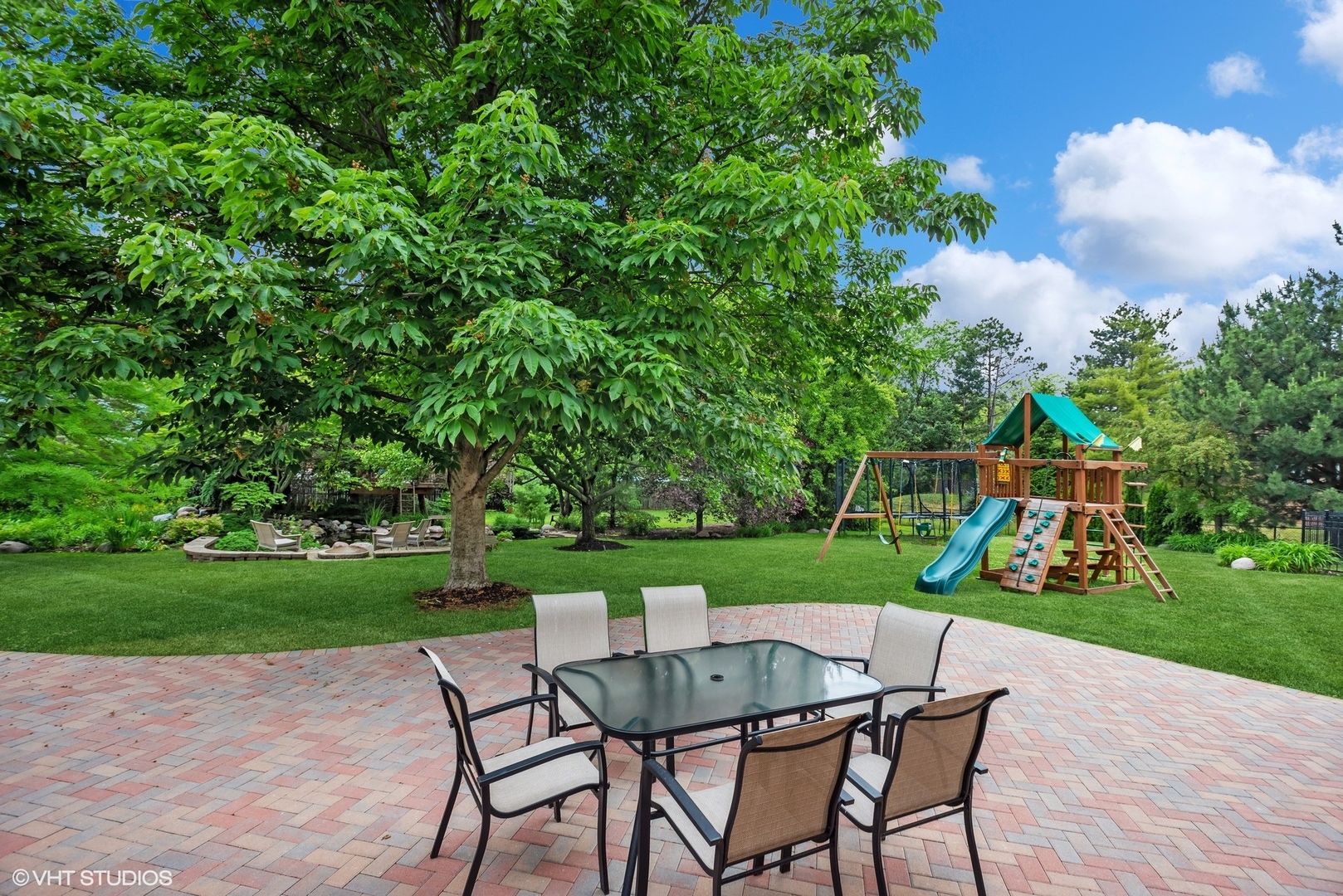 2420 Dorina Drive Northfield, IL 60093 - Photo 46 of 51 a view of a table and chairs in backyard
