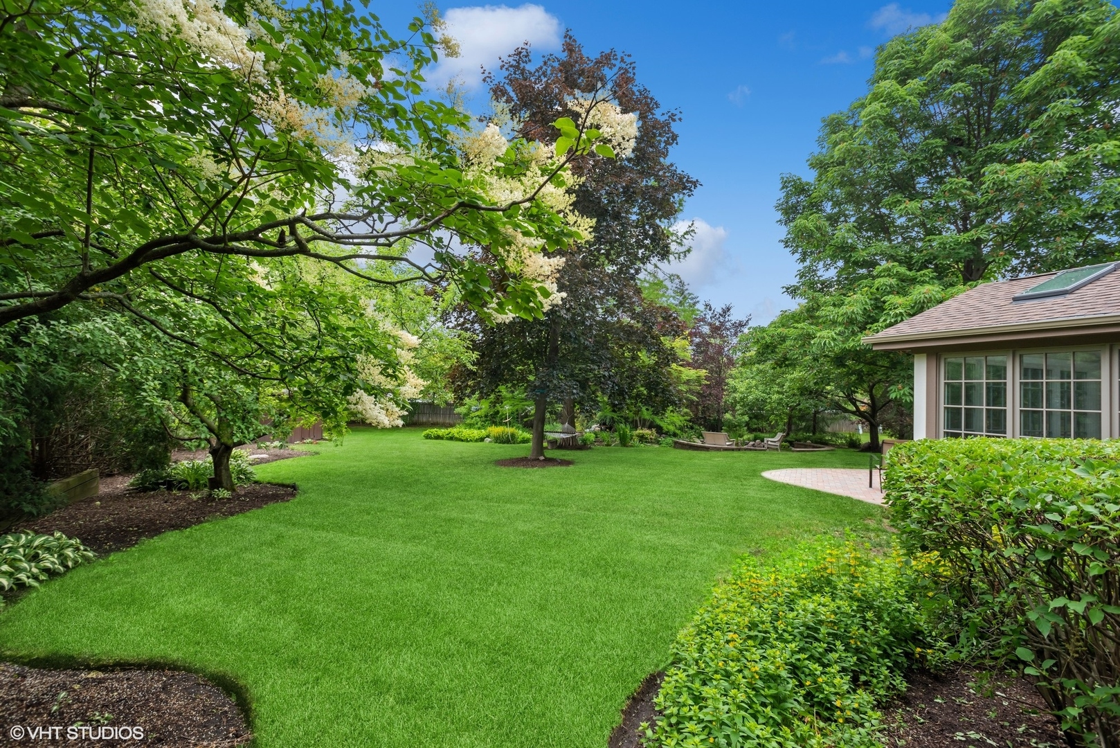 2420 Dorina Drive Northfield, IL 60093 - Photo 47 of 51 a view of a backyard with a garden