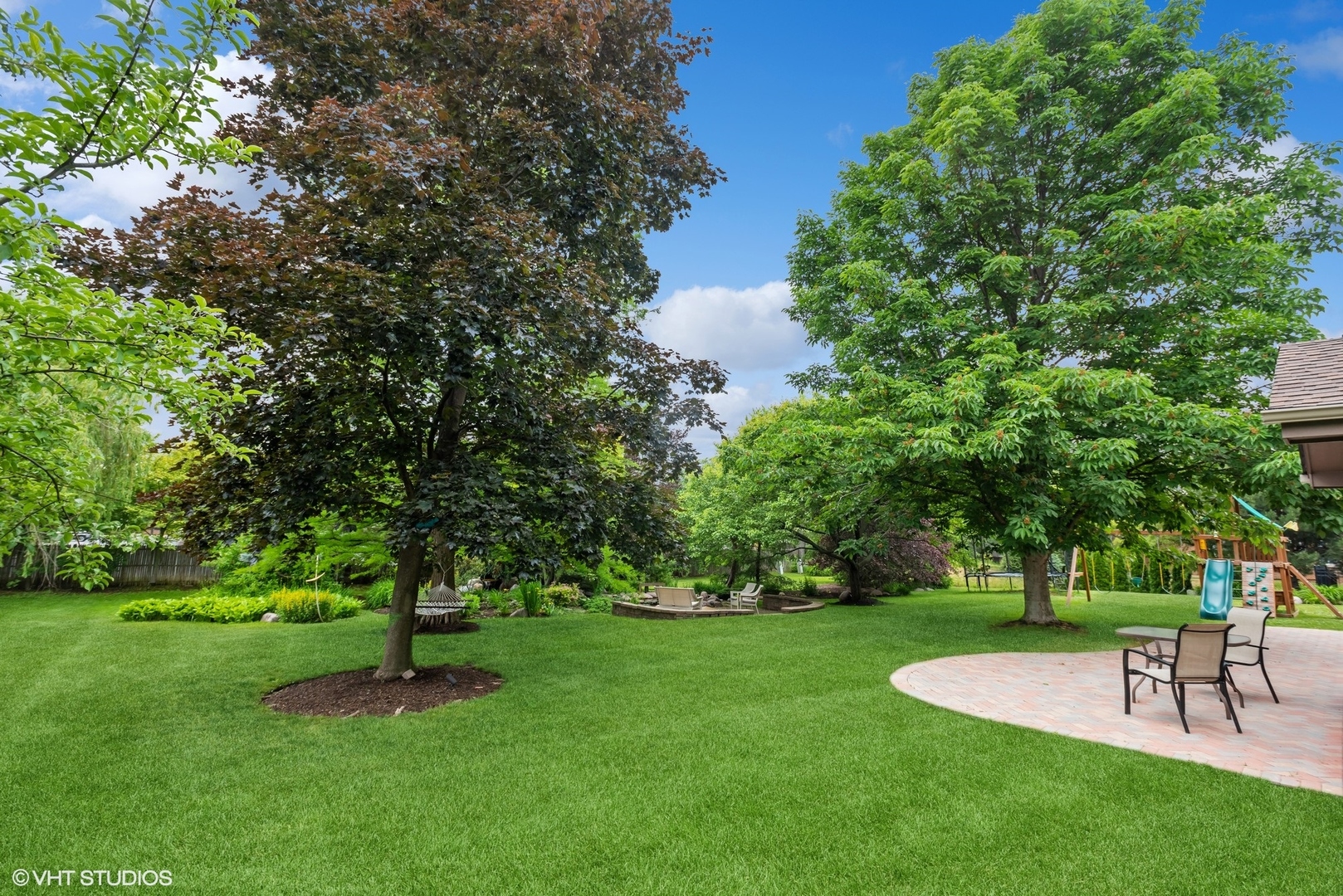 2420 Dorina Drive Northfield, IL 60093 - Photo 48 of 51 a view of a backyard with a garden