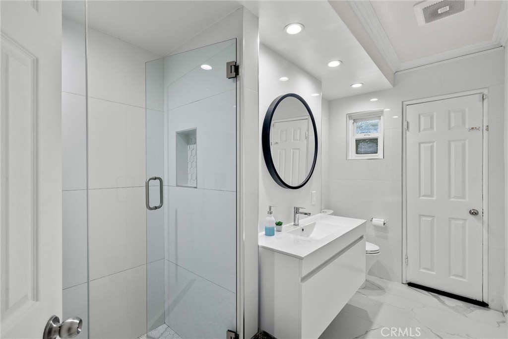 1519 Lynglen Drive Glendale, CA 91206 - Photo 21 of 39 a bathroom with a sink a toilet and shower