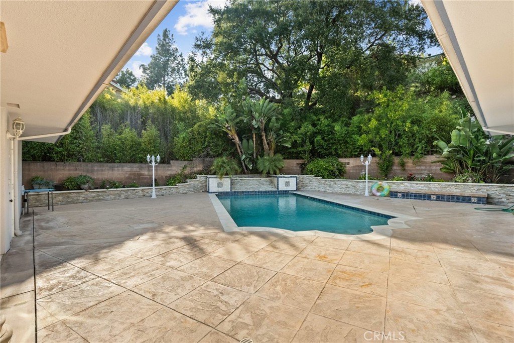 1519 Lynglen Drive Glendale, CA 91206 - Photo 34 of 39 a view of a swimming pool with a patio