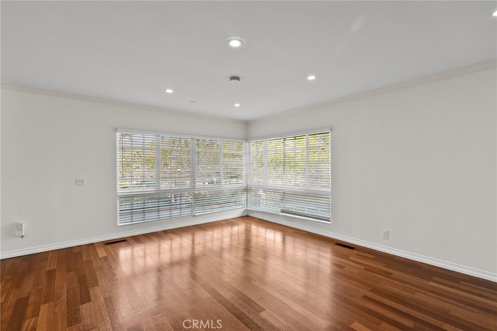 1519 Lynglen Drive Glendale, CA 91206 - Photo 10 of 39 a view of empty room with wooden floor and fan
