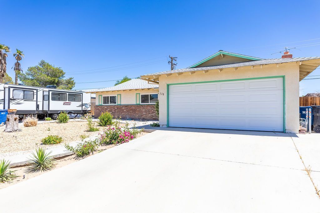 328 Peg Street Ridgecrest, CA 93555 - Photo 20 of 20 a front view of a house with a yard