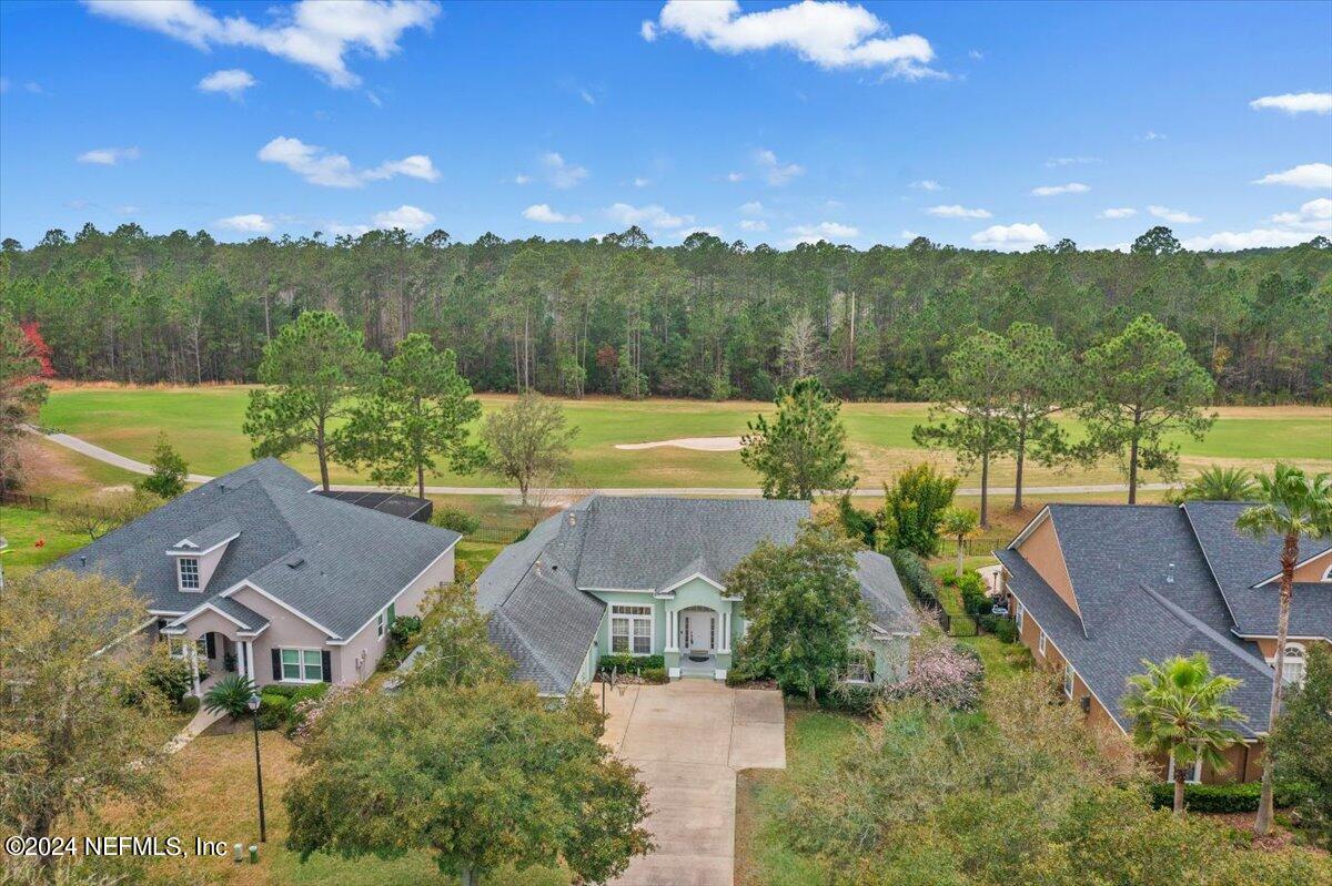 an aerial view of houses with yard