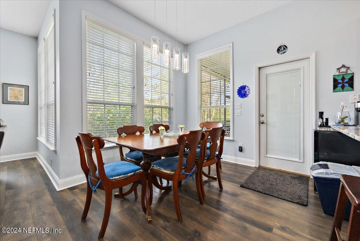 757 Eagle Point Drive St. Augustine, FL 32092 - Photo 11 of 44 a view of a dining room with furniture and wooden floor