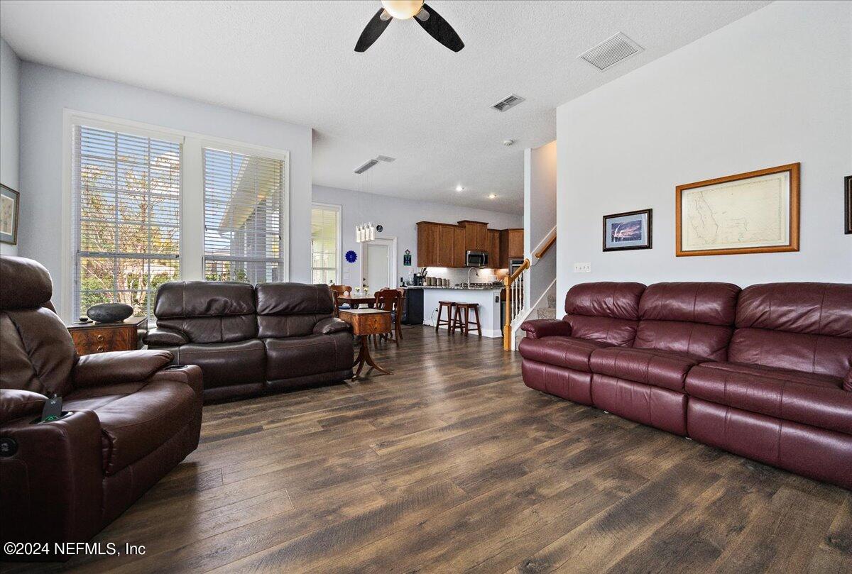 757 Eagle Point Drive St. Augustine, FL 32092 - Photo 12 of 44 a living room with furniture ceiling fan and a window