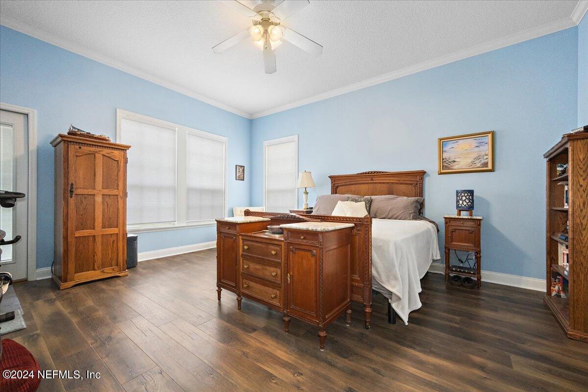 757 Eagle Point Drive St. Augustine, FL 32092 - Photo 14 of 44 a bed room with a bed and a television