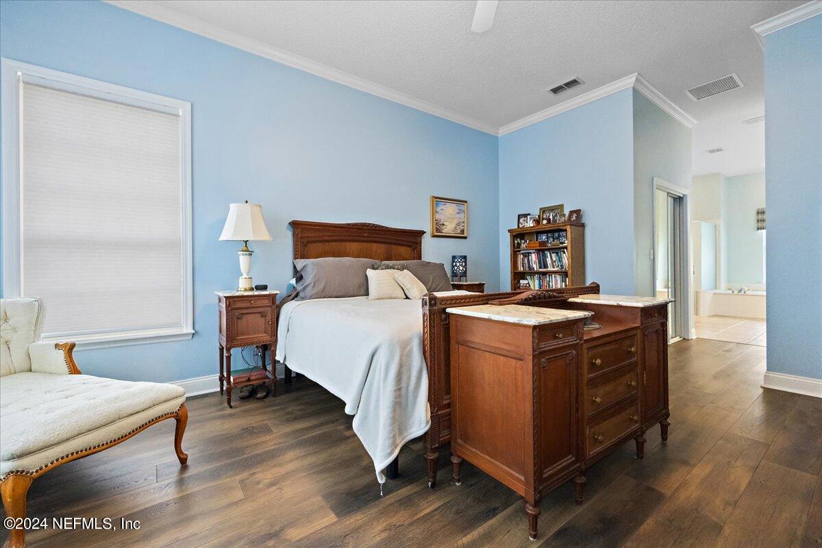 757 Eagle Point Drive St. Augustine, FL 32092 - Photo 15 of 44 a bed room with a bed and a dresser