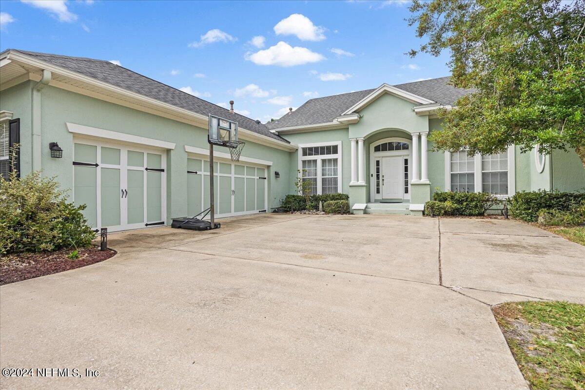 757 Eagle Point Drive St. Augustine, FL 32092 - Photo 2 of 44 a view of a white house with a outdoor space and street view