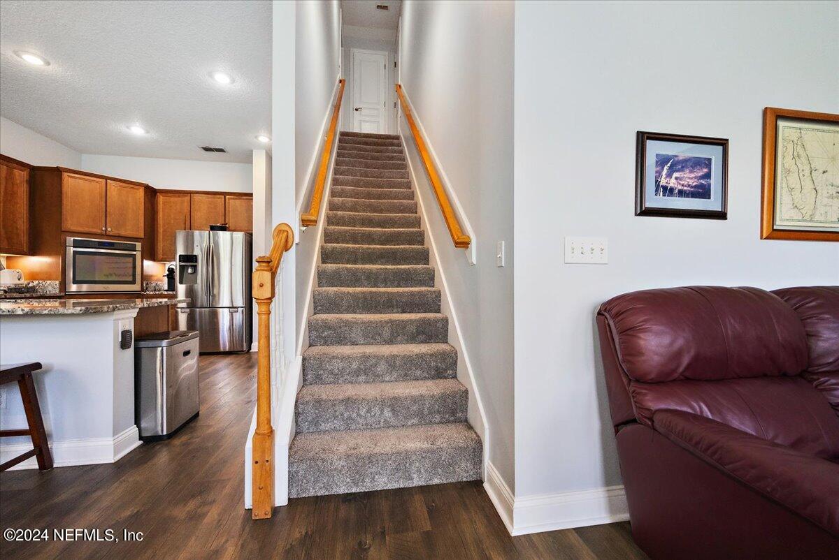 757 Eagle Point Drive St. Augustine, FL 32092 - Photo 25 of 44 a living room with furniture and a wooden floor
