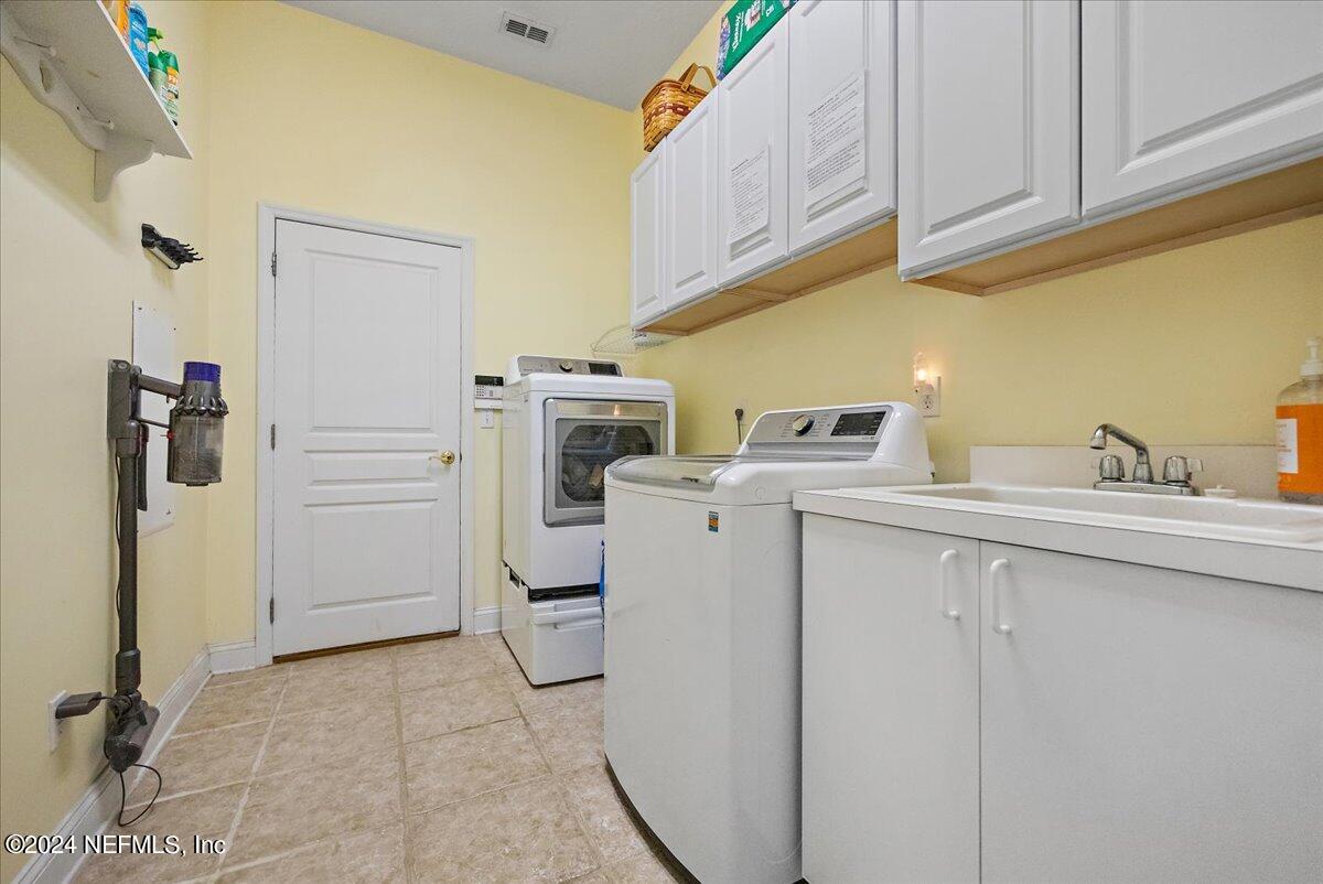 757 Eagle Point Drive St. Augustine, FL 32092 - Photo 26 of 44 a utility room with dryer and washer