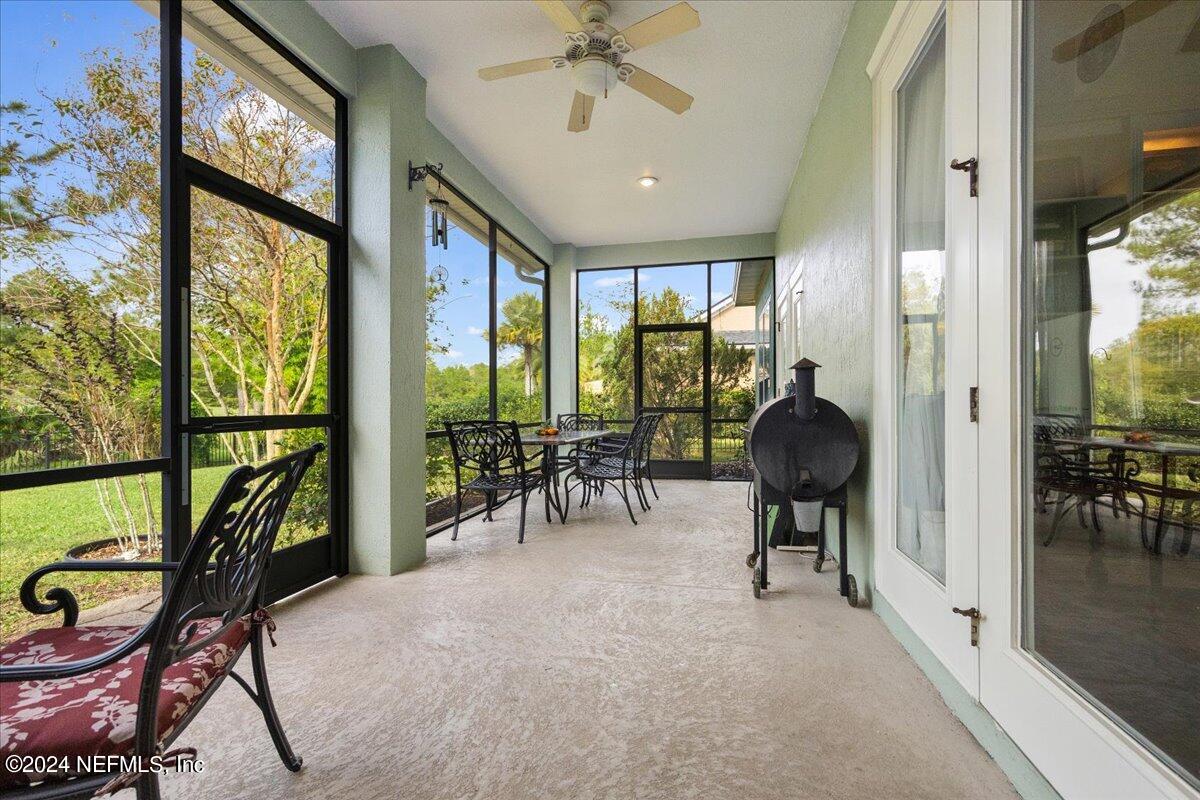 757 Eagle Point Drive St. Augustine, FL 32092 - Photo 27 of 44 a view of a livingroom with furniture wooden floor and a floor to ceiling window