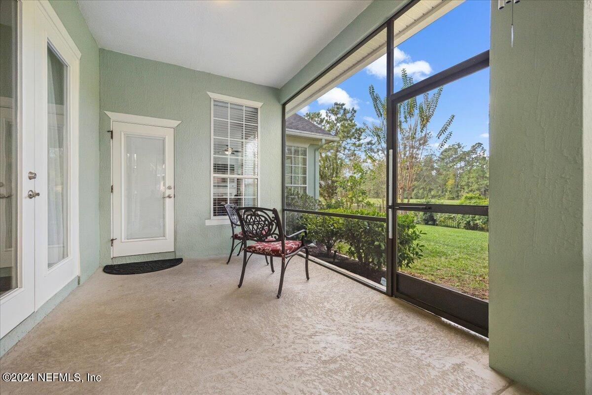 757 Eagle Point Drive St. Augustine, FL 32092 - Photo 28 of 44 a balcony with chairs and a table