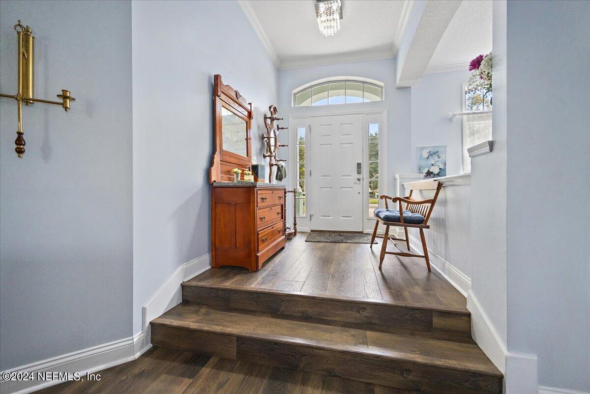 757 Eagle Point Drive St. Augustine, FL 32092 - Photo 3 of 44 a view of dining room with furniture and wooden floor