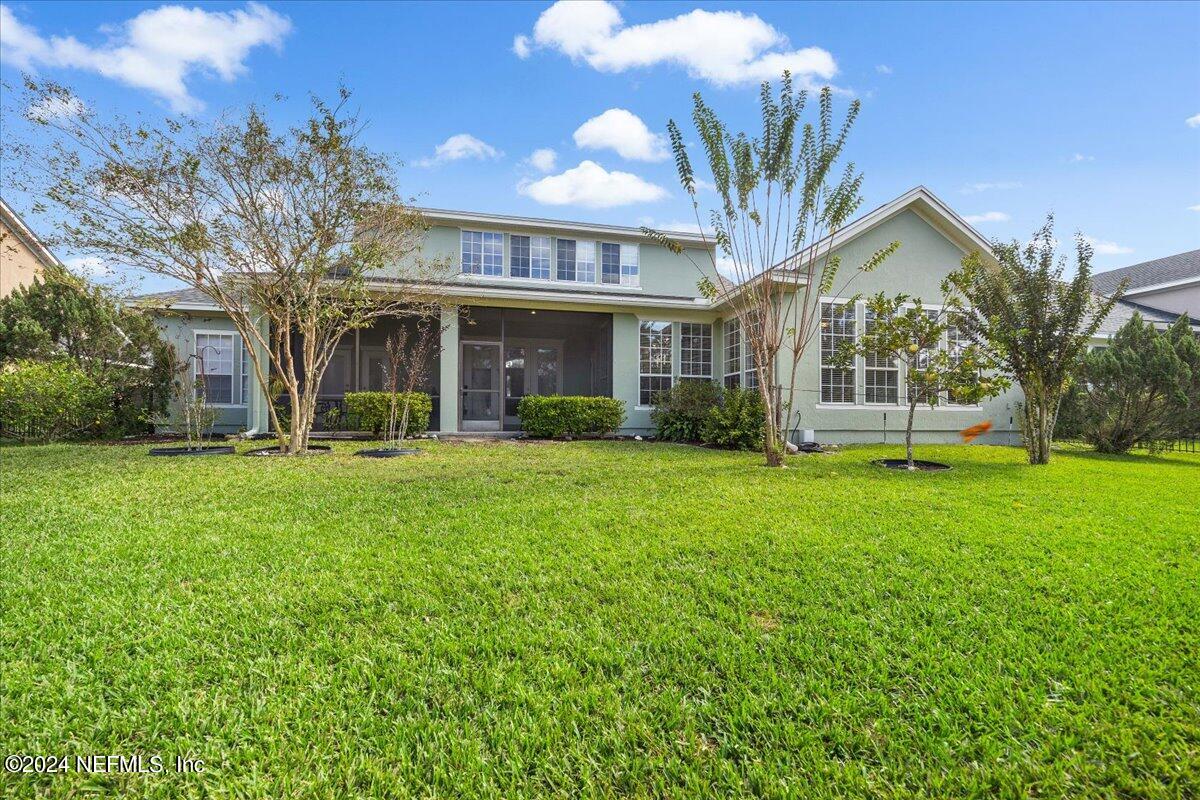 757 Eagle Point Drive St. Augustine, FL 32092 - Photo 32 of 44 a front view of a house with garden