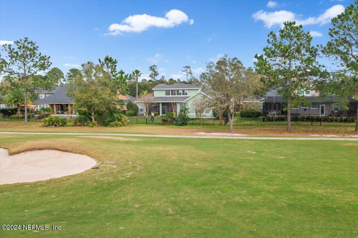 757 Eagle Point Drive St. Augustine, FL 32092 - Photo 35 of 44 a view of a tennis ground with large trees