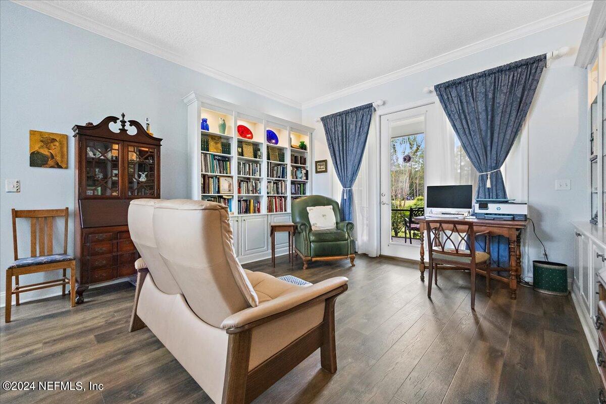 757 Eagle Point Drive St. Augustine, FL 32092 - Photo 7 of 44 a living room with furniture and a wooden floor