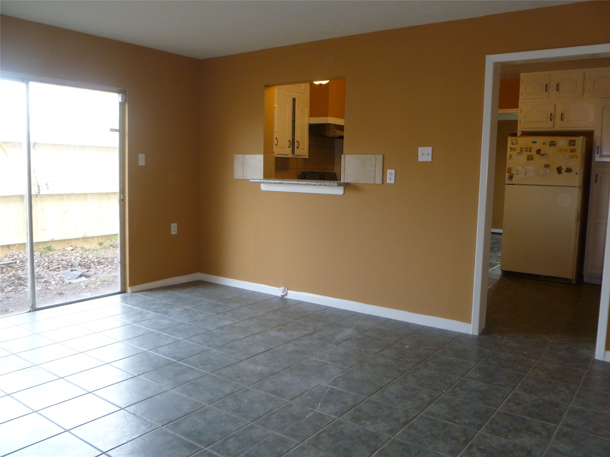 3802 Wichita Street, Unit 1 Houston, TX 77004 - Photo 3 of 10 Dining room looking out to small side yard and kitchen (pic with old tile)