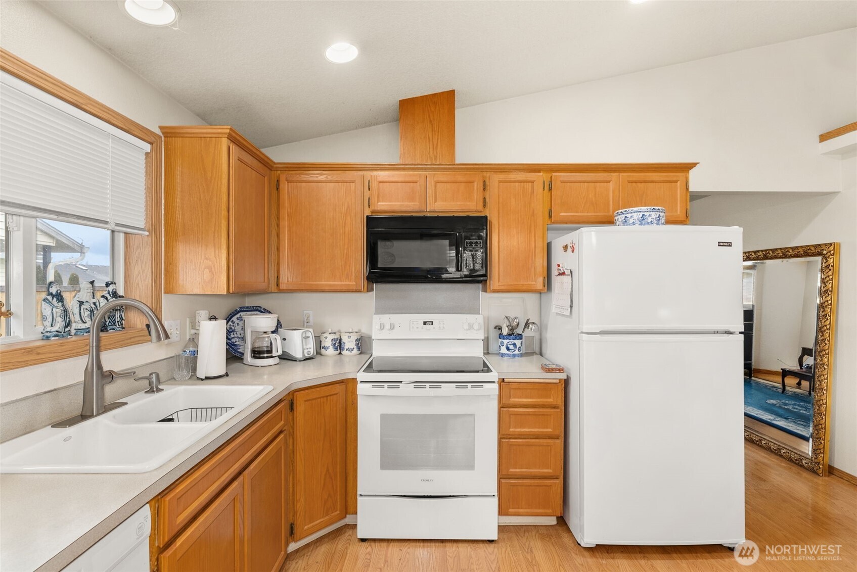 118 Rose Marie Drive Chehalis, WA 98532 - Photo 12 of 27 a kitchen with a sink a refrigerator and a stove top oven