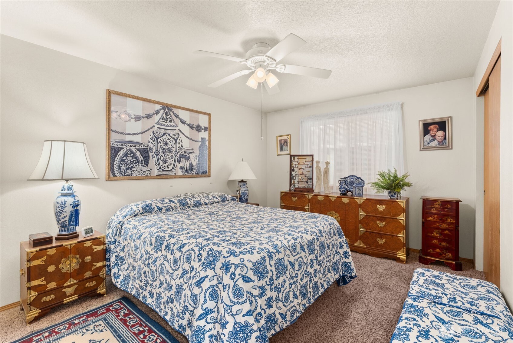 118 Rose Marie Drive Chehalis, WA 98532 - Photo 16 of 27 a bedroom with a bed and a chandelier