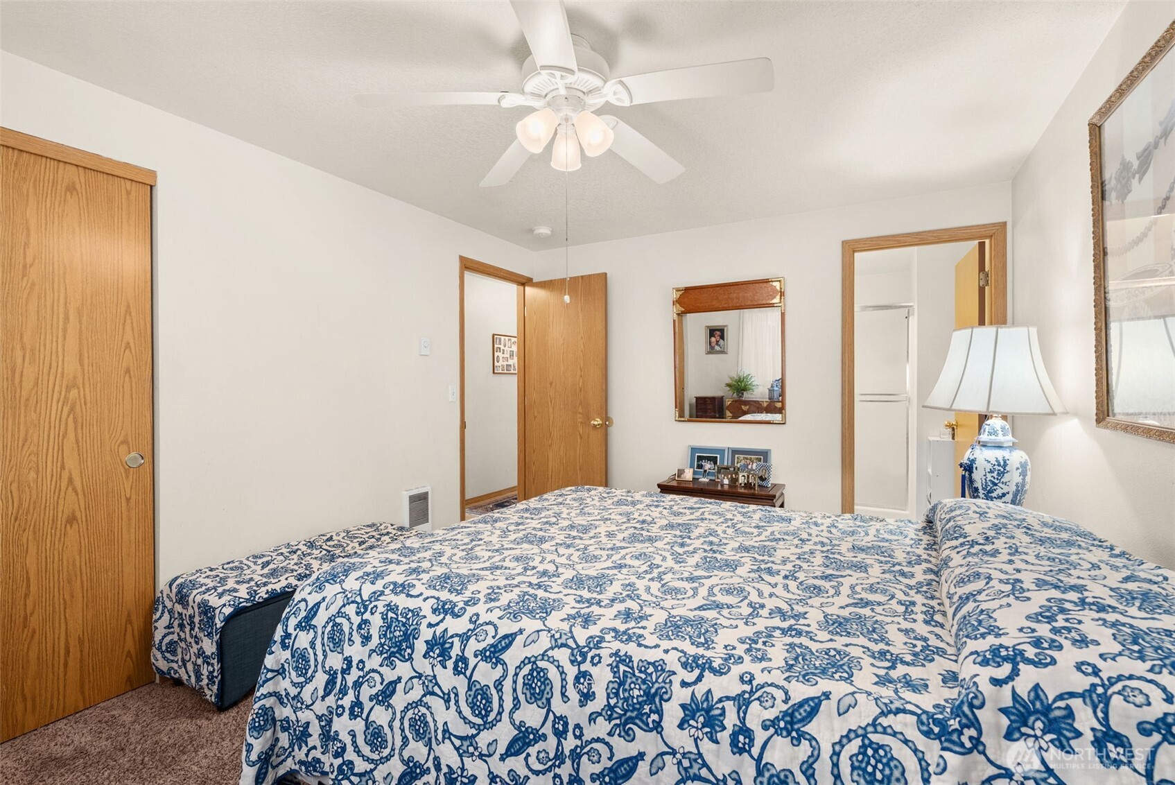 118 Rose Marie Drive Chehalis, WA 98532 - Photo 17 of 27 a bedroom with a large bed and a chandelier
