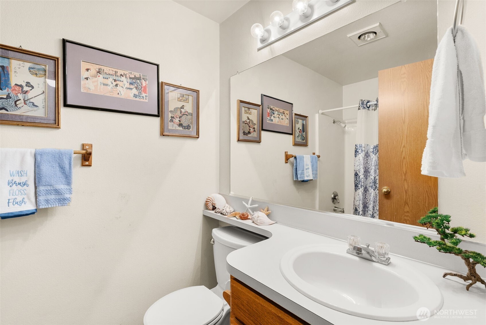 118 Rose Marie Drive Chehalis, WA 98532 - Photo 20 of 27 a bathroom with a sink vanity mirror and toilet