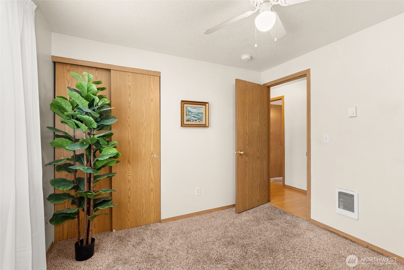 118 Rose Marie Drive Chehalis, WA 98532 - Photo 22 of 27 an empty room with potted plants and wooden floor