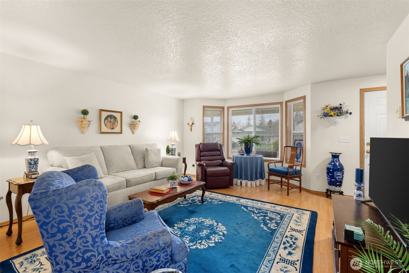 118 Rose Marie Drive Chehalis, WA 98532 - Photo 7 of 27 a living room with furniture a rug a lamp and a window