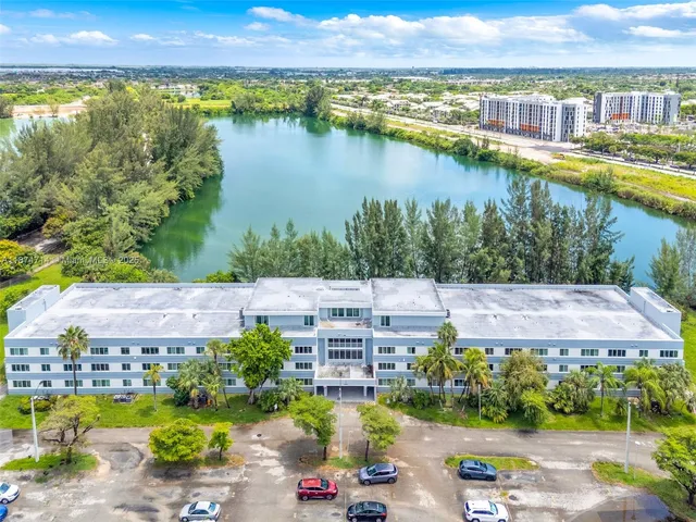 a view of a lake with a city and a mountain view