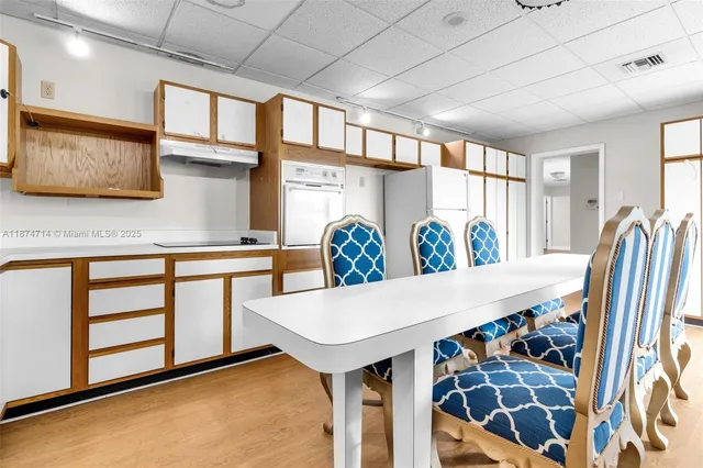 a view of a kitchen with furniture and window
