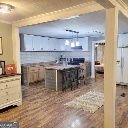 a kitchen with a cabinets a sink and counter space