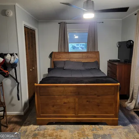 a living room with furniture and a air conditioner vent