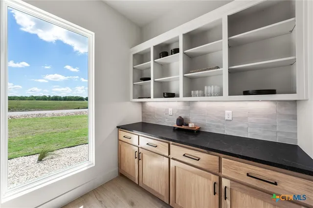 a close view of kitchen with a sink and dishwasher