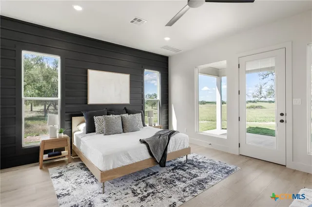 a bed room with a bed and a window