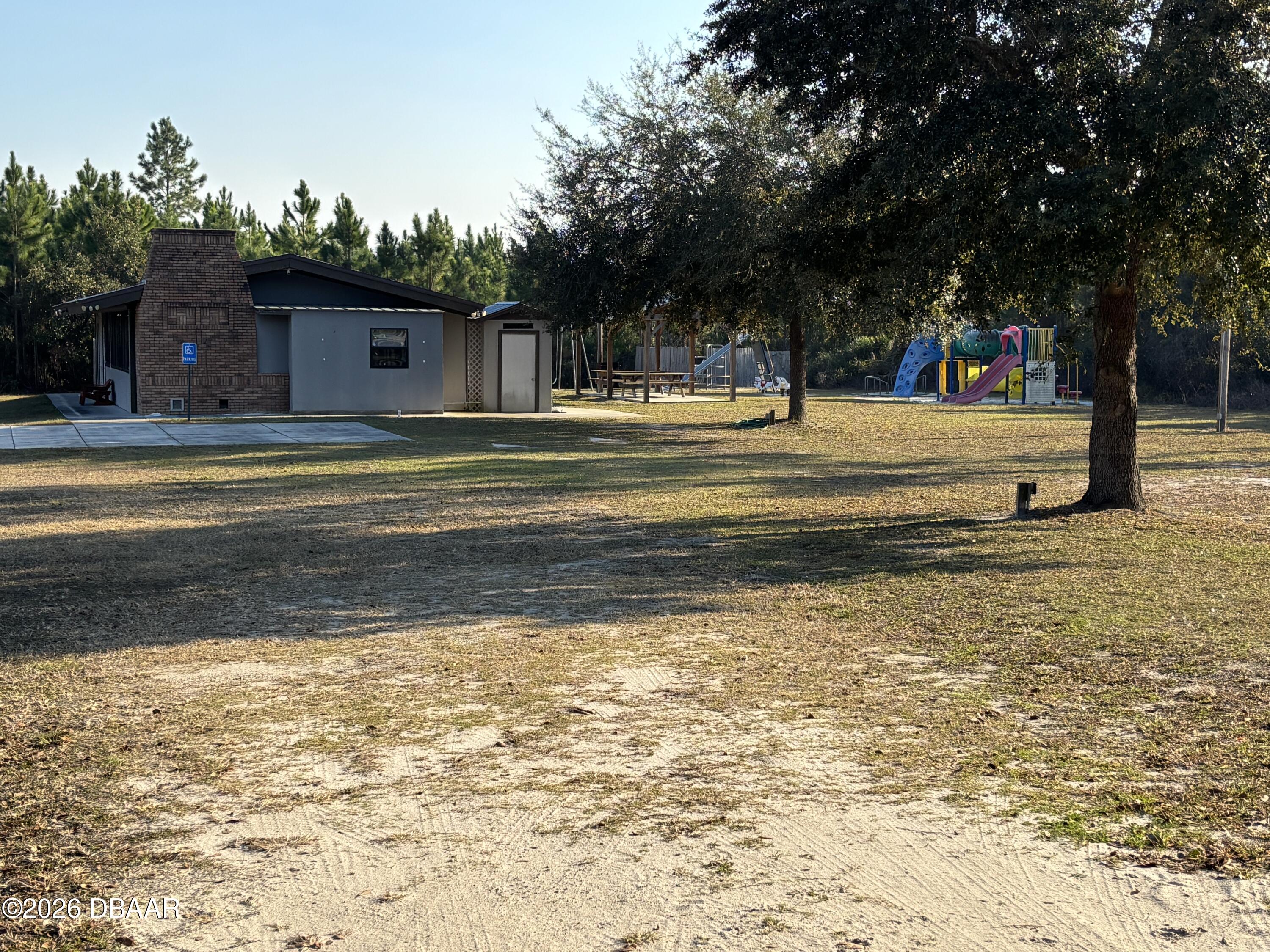 0 Saffron Avenue Eustis, FL 32736 - Photo 5 of 7 a view of swimming pool with trees
