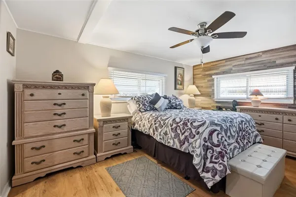 a bedroom with a bed and a dresser