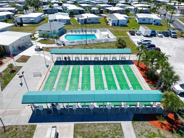 a view of swimming pool with seating area