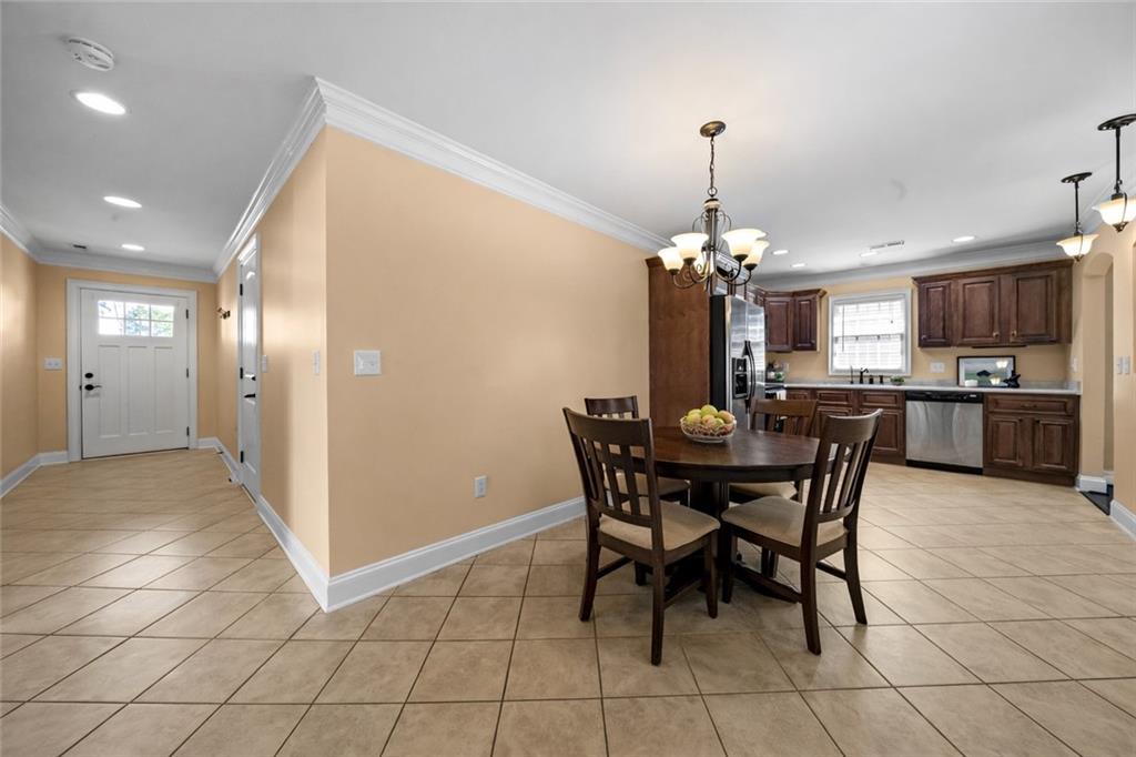 23 Walton Creek Drive Southwest Rome, GA 30165 - Photo 11 of 35 a view of a dining room with furniture and chandelier