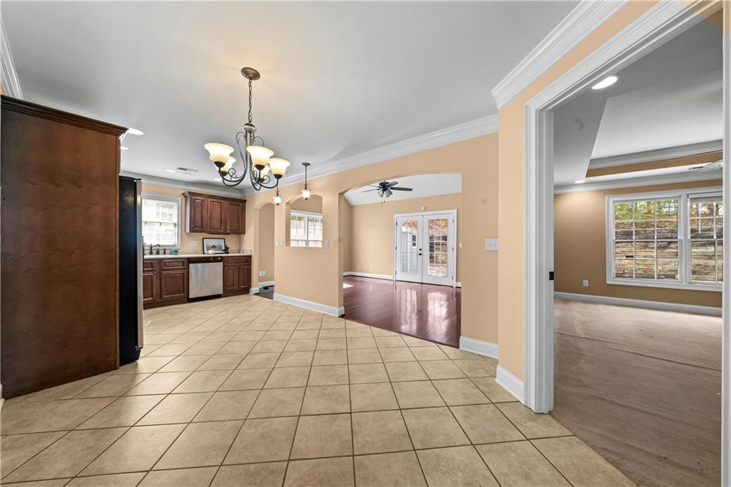 23 Walton Creek Drive Southwest Rome, GA 30165 - Photo 15 of 35 a room with kitchen island granite countertop furniture and a chandelier