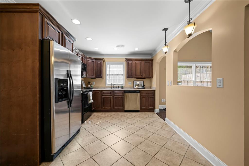 23 Walton Creek Drive Southwest Rome, GA 30165 - Photo 17 of 35 a kitchen with granite countertop a refrigerator and a sink