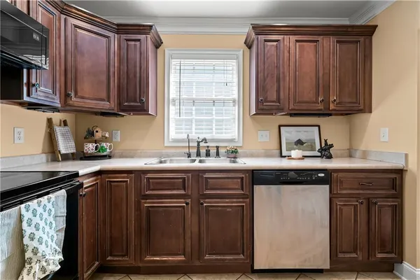 a kitchen with a refrigerator sink and microwave