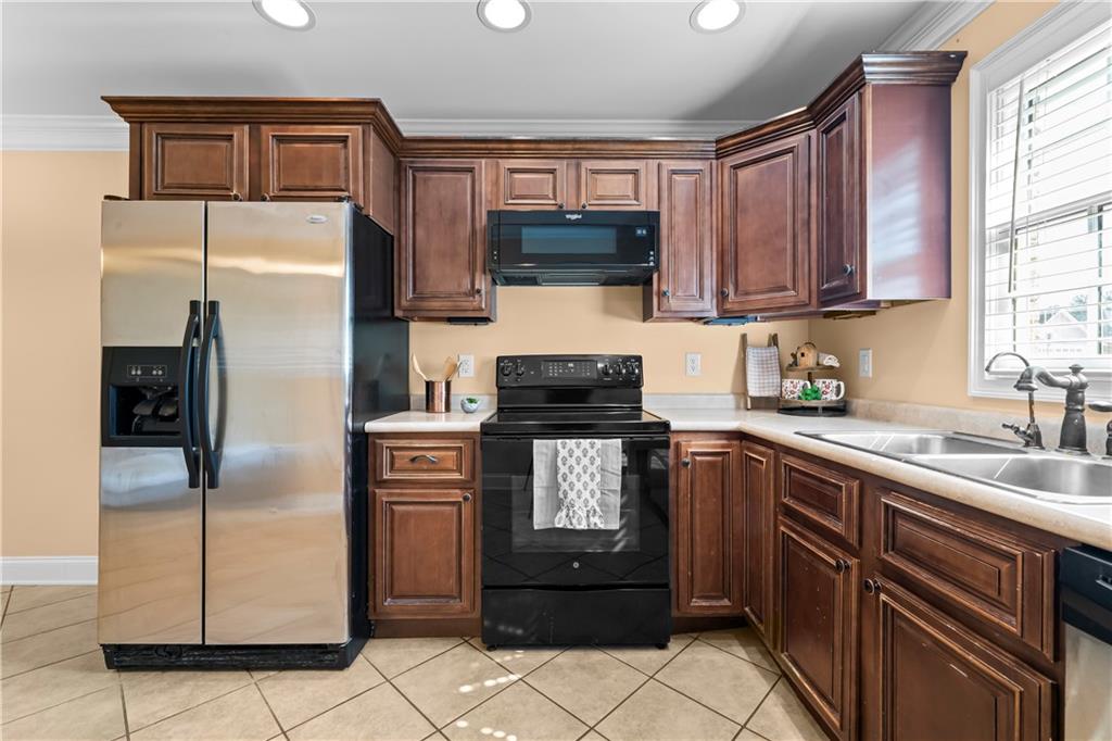 23 Walton Creek Drive Southwest Rome, GA 30165 - Photo 20 of 35 a kitchen with a refrigerator sink and microwave