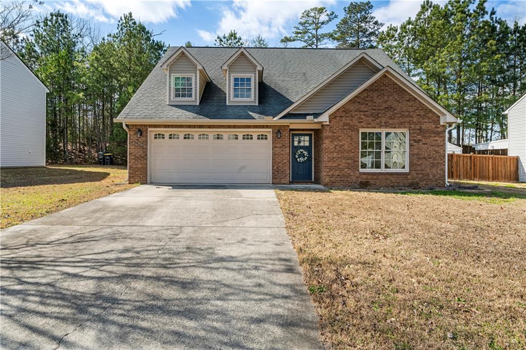 23 Walton Creek Drive Southwest Rome, GA 30165 - Photo 2 of 35 a front view of a house with a yard and garage