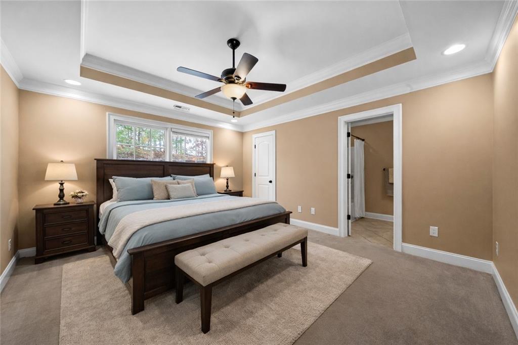 23 Walton Creek Drive Southwest Rome, GA 30165 - Photo 27 of 35 a spacious bedroom with a bed and a ceiling fan