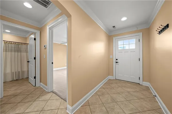 a view of a hallway with wooden shelves